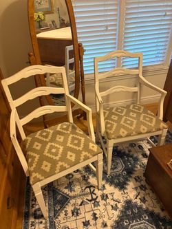 2 white chairs