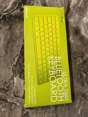 new sealed Bluetooth ultra slim Bluetooth keyboard