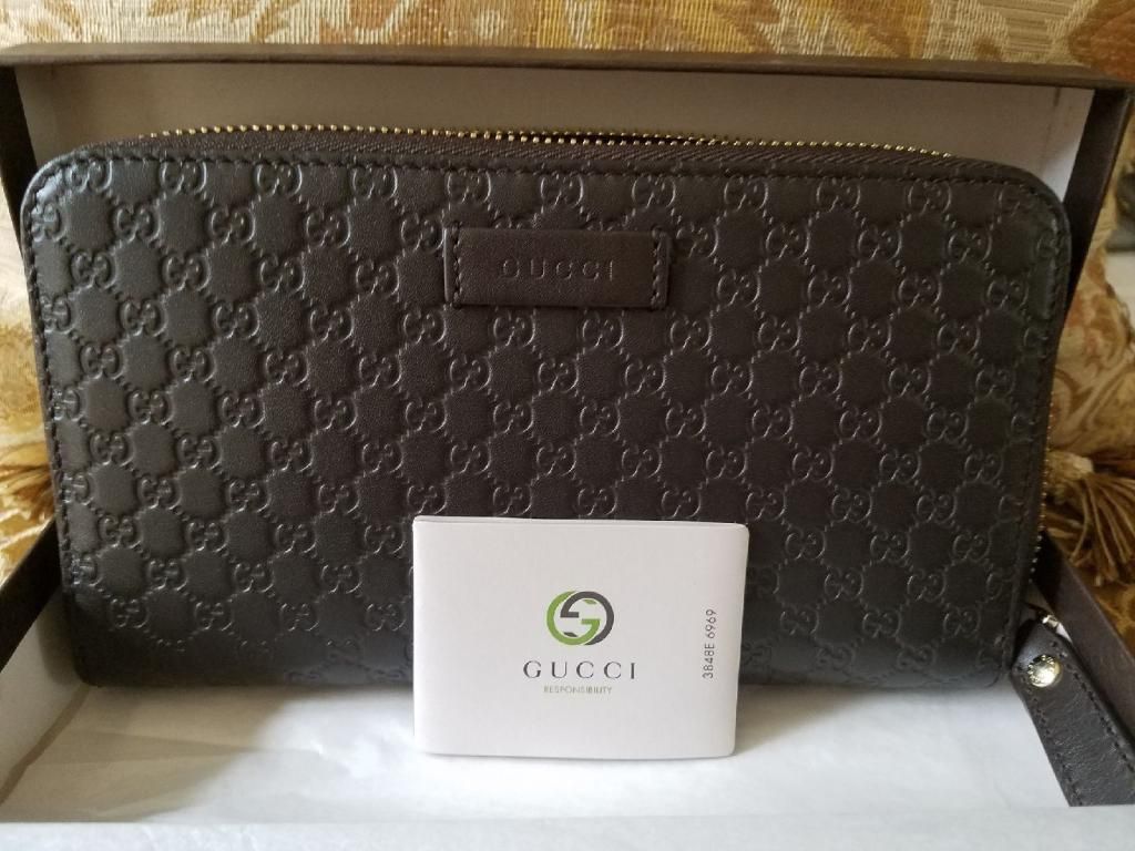 Dark Brown gucci wallet (authentic leather and tags)