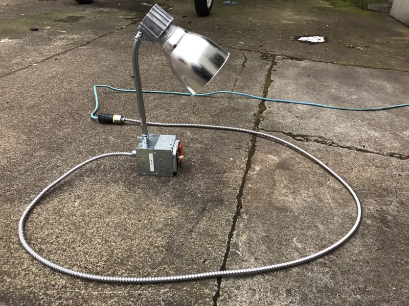 Scrap metal desk lamp with outlets