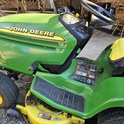 JOHN Deer  riding lawn mower  $2,000.00