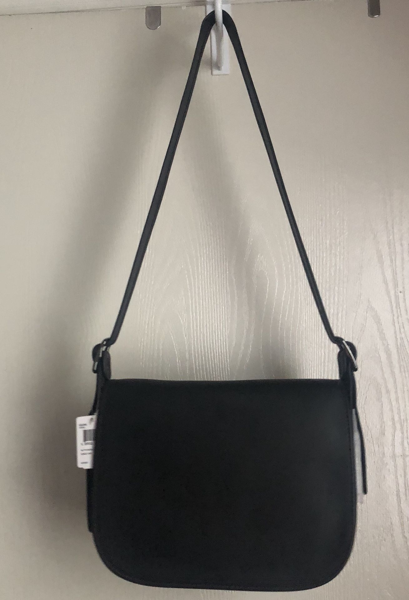 Classic Coach saddle bag. New! Never used. Black with burgundy stitcning. Originally $399, selling for $199.