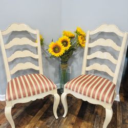 2 dining chairs in the French provincial style.