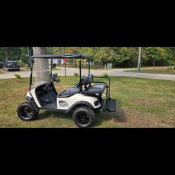 2013 Ez-Go Txt electric golf cart. New batteries in July. Less than 30 minutes used since battery replacement. Newer tires and lift. Upgraded charger.