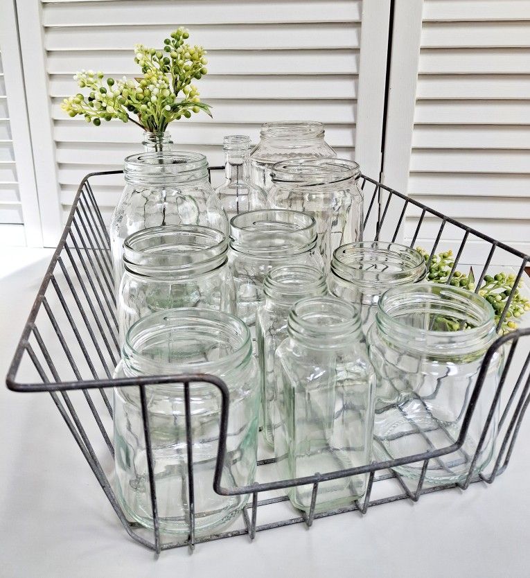 Collection of various glass jars in a vintage metal basket - Best Offer