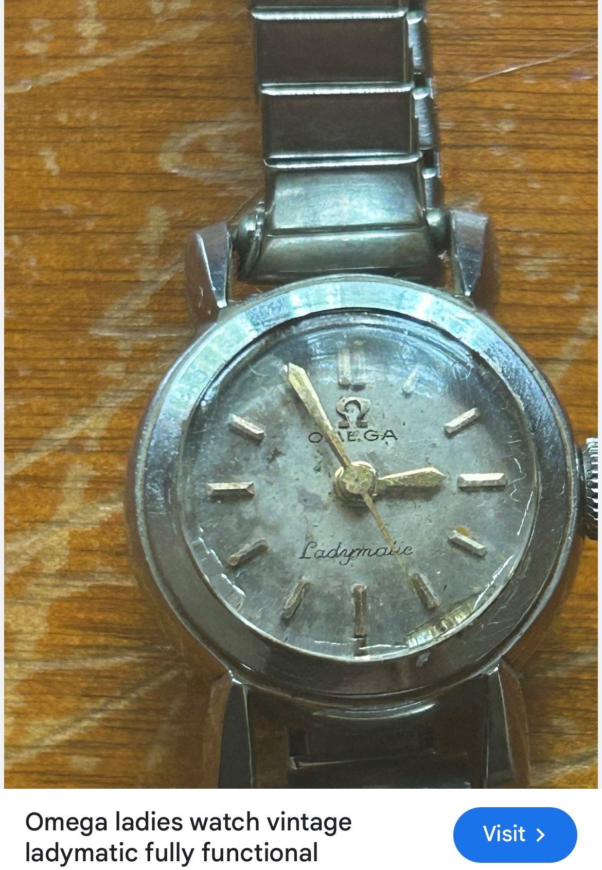 This is a vintage Omega Ladymatic women's automatic wristwatch in a silver-tone steel case