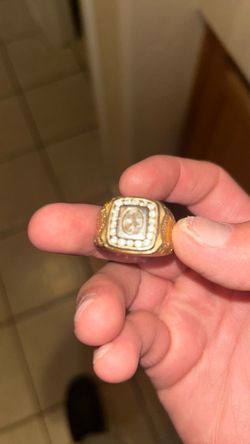 The gold ring with diamonds