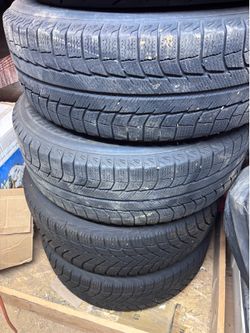 Kia wheels w/michelin snow tires (fits Toyota)