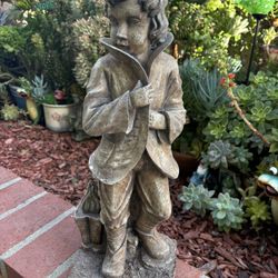 Garden Statue Of A Boy