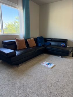 Moving sale : Sleek Black Leather Sectional Sofa – Adjustable Headrests .