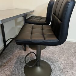 2 adjustable height leather chairs