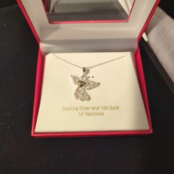 Beautiful Vintage Sterling Silver Angel Pendant with a 10k Gold Heart on a necklace.