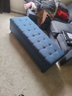 Blue fabric storage ottoman bench