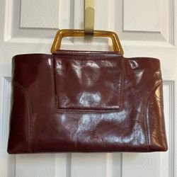 DKNY burgundy top handle leather bag.