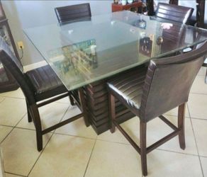 Glass Top Dining Room Table With Wood Base and 4 Leather Chairs