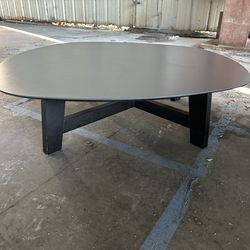 Two low tables with egg-shaped surfaces like two-dimensional projections