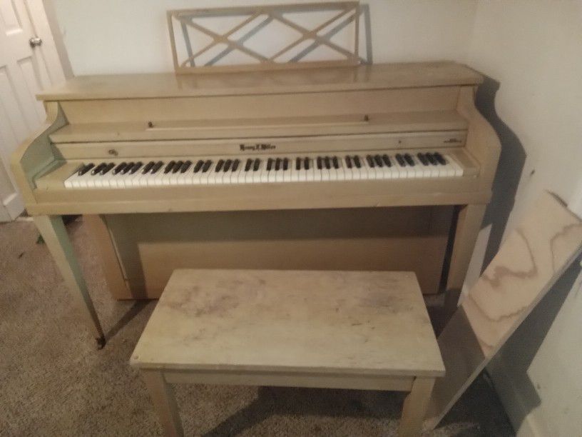 Piano With Tuner And Bench