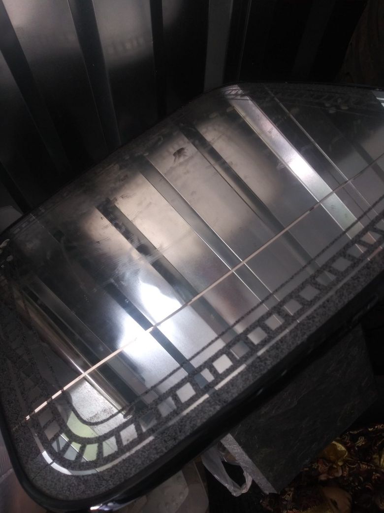Black end table with mirror cracked