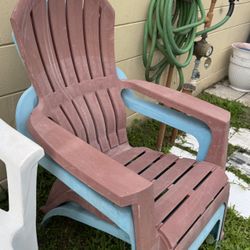 Set of two blue and coral resin patio Adirondack chairs