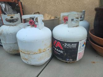 4 Used full propane canisters