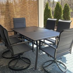 Outdoor patio table with 6 swivel chairs