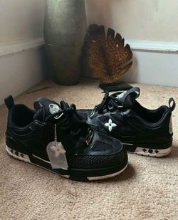 Black and white Louis Vuitton skates