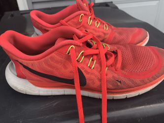 Shrimp color Nike running shoe