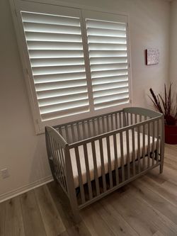 Delta 4-in-1 Convertible Crib with Mattress and Bedding