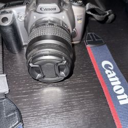 Canon EOS Rebel G2 Film Camera Kit Kit Len with strap/B&W Film Cartridge/6 B&W Negative Film Cartridges/B&W paper & Mount board 