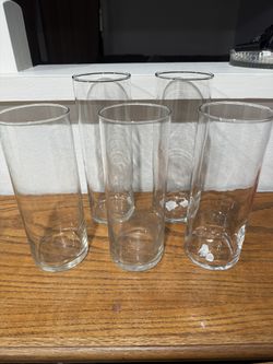 FIVE CLEAR FLOWER VASES