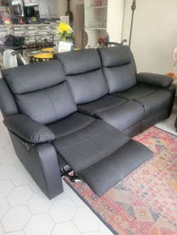 Reclining couch. Black Faux leather.