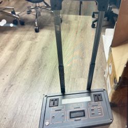 Versatile portable power station with a silver and black exterior. This unit has multiple USB ports, AC outlets, and a digital display for monitoring 