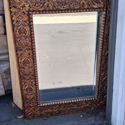 Hand carved wood composite mirror with beveled edges.  4'x3'.  Used, but in great condition.  Heavy.