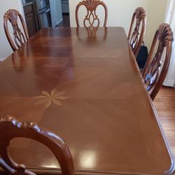 Formal Dining Table set and a China Hutch Sold together. or two items.