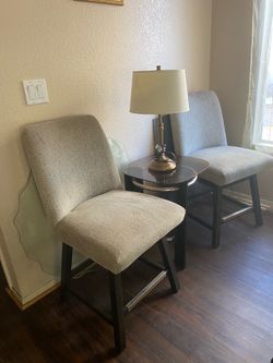 2 Ashley Burkhaus swivel bar stools