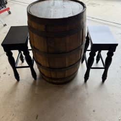 whiskey barrel with stools 