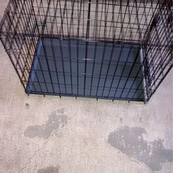 Dog cage medium size . Normal wear good condition .