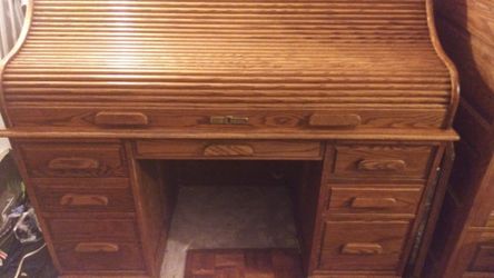 Solid oak desk all wood. W. File cabenet W oak chair and wood floorW regulater oak clock