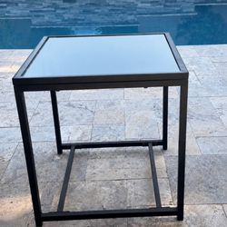 Outdoor patio small glass table. 