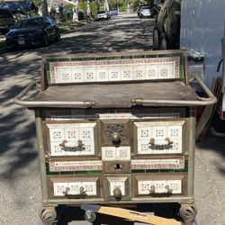 European cast iron stove with decorative tiles.