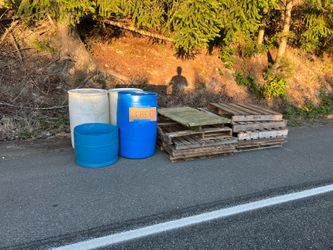 FREE CURBSIDE - 55 gallon drums and wood pallets