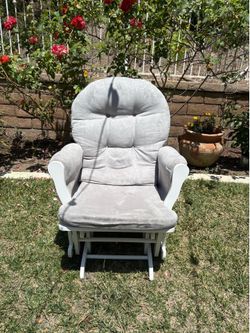 Grey cushion and white frame glider chair