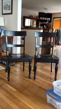 2 sturdy black dining room chairs