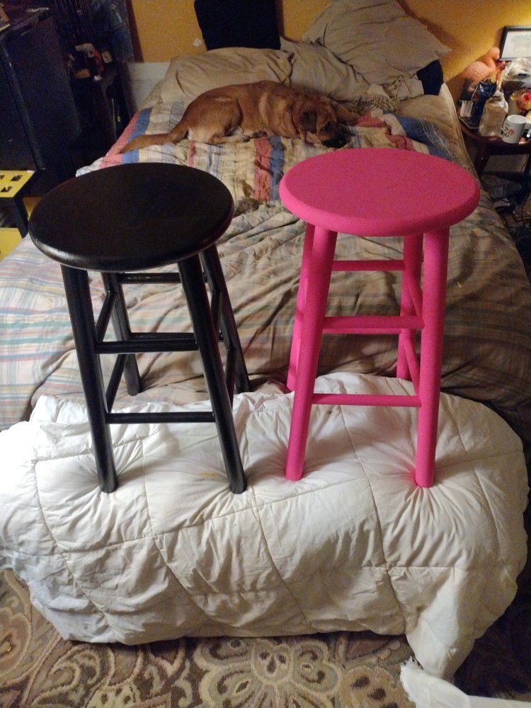 His And Hers Stools Jet Black And Diva Pink Made Of Solid Oak Wood. 24 1/2 In High. At Seat The Width Is 12 In At Legs It's 9 In