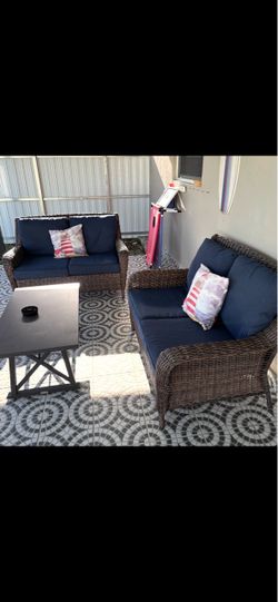 Two new wicker outdoor couches table included.