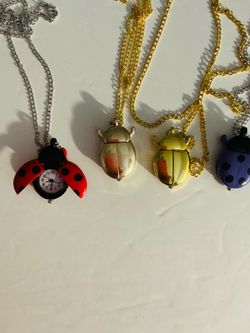NEW LADYBUG NECKLACE WATCHES - $12 each
