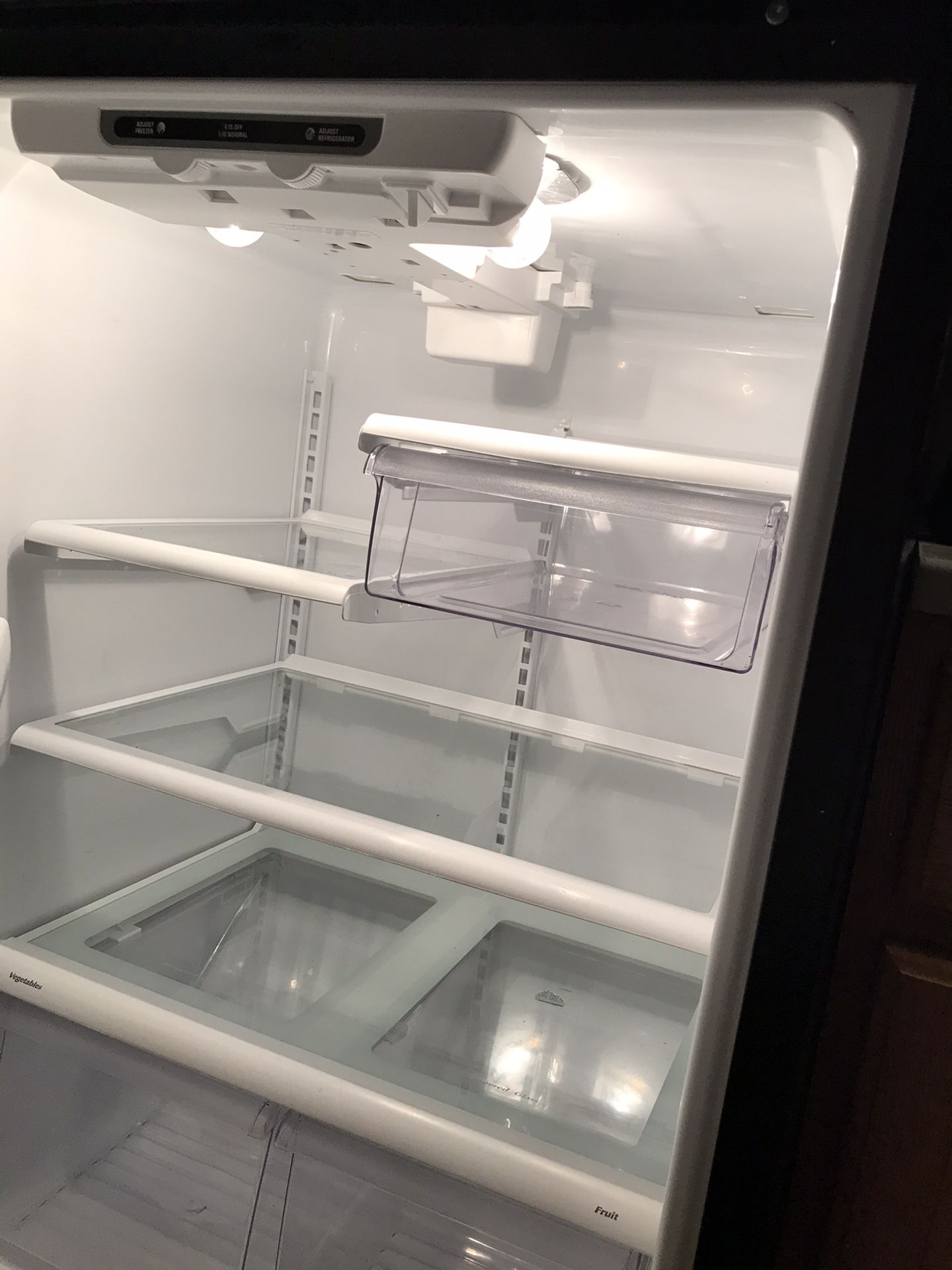 Refrigerator with small dent . Perfect for garage or basement