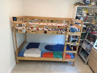 IKEA bunk bed with mattresses and sheets
