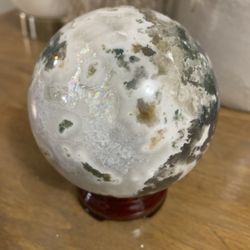 Moss agate sphere with rainbows