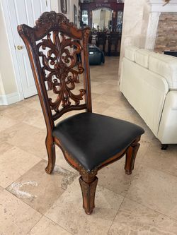 Ornate Carved Wood Dining Chairs with Tufted Faux Leather